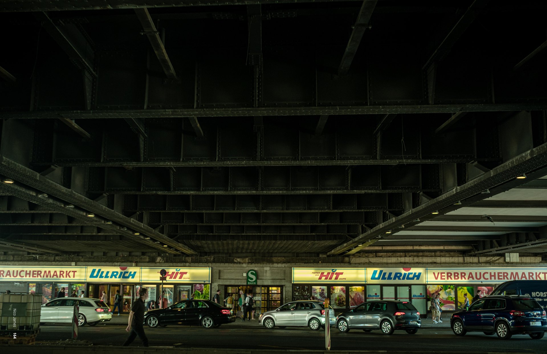 Storefronts under a bridge