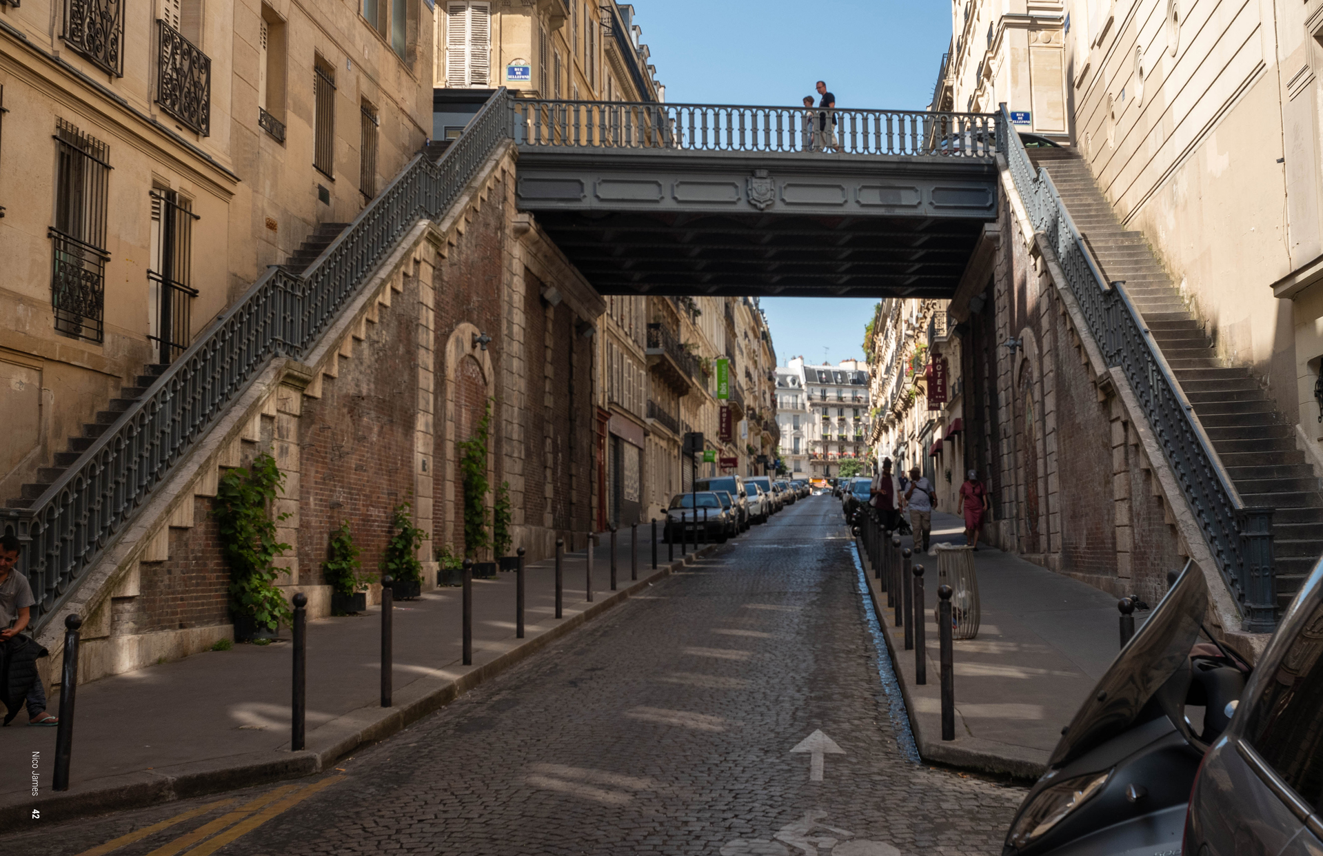 Photograph of outdoor double staircase and pedestrian bridge